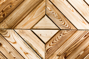 Natural wooden texture. Mosaic wood background. Diagonal shape plank. Board structure. Brown color impregnated outdoor wood pattern. Bright backdrop. Wooden stripes. Natural lines pattern.