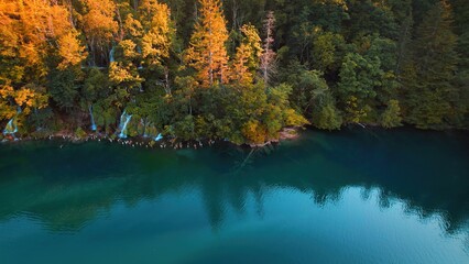 Plitvice lakes National Park in Croatia. Aerial view of waterfall and bright fresh water in autumn.