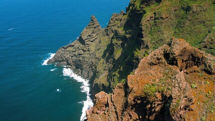 Fototapeta premium Green mountain landscape on ocean coastline, hiking trail in Anaga rural park. Chinamada Tenerife Canary Islands Spain.