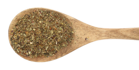 Dried and chopped up basil spice pile in wooden spoon isolated on white, top view
