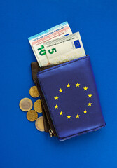 Old wallet and small euro banknotes and coins. concept poverty inflation and consumer financial crisis in Europe