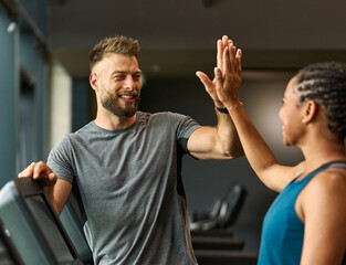 gym sport fitness exercise health training woman teamwork happy together friend success high five trainer instructor gesture support coach motivation treadmill running man trainer instructor coach
