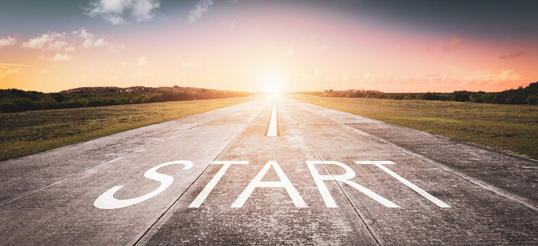 Start word written on the road. The beginning of something new. Business and getting ahead concept.