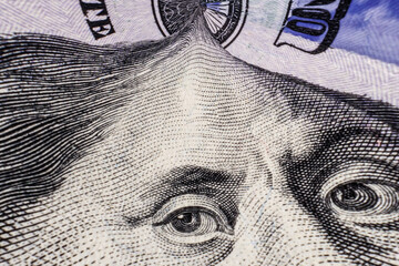 Warped Closeup of Ben Franklin on a 100 one hundred dollar bill for background.