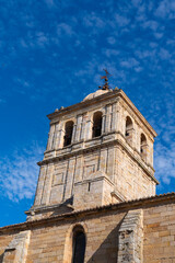 Aguilar de Campoo church tower of St. Michael the Archangel in the town square Palencia, Castilla y León, Spain