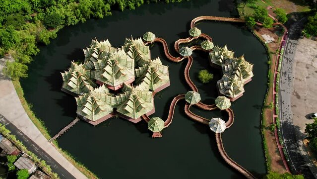 Beautiful buddhist temple in a town near Bangkok, Thailand. Aerial drone footage, top down view. 