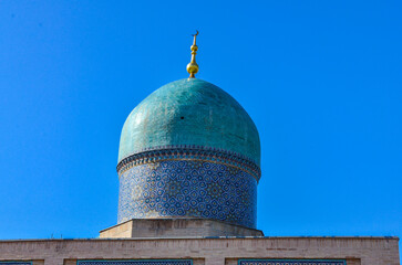 blue dome with traditional tile decorations of Barakhan Madrasah in Khazrati Imam Complex...