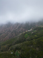 fog with wind and misty cloud in green mountains, Anaga park, Tenerife, Canary