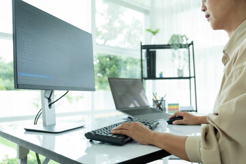 Female IT programmer innovates at office desk.