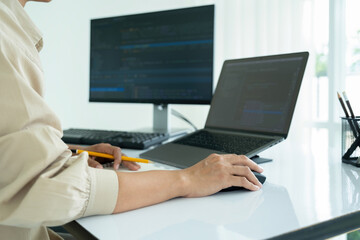 Female IT programmer innovates at office desk.