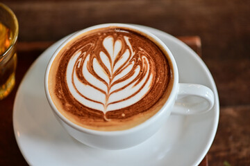 high angle view of coffee cup on wood grain table Drinking Concept: Hot Coffee, Latte, Espresso, Cappuccino