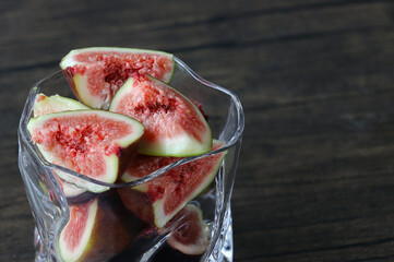 Fresh ripe figs in a transparent glass