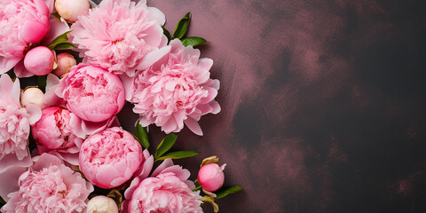 flat lay, peony flowers on a pink background. border of pink flowers with space for text.