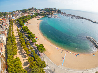 San Feliu de Guixols on the Costa Brava of Girona images of the beach, main and port