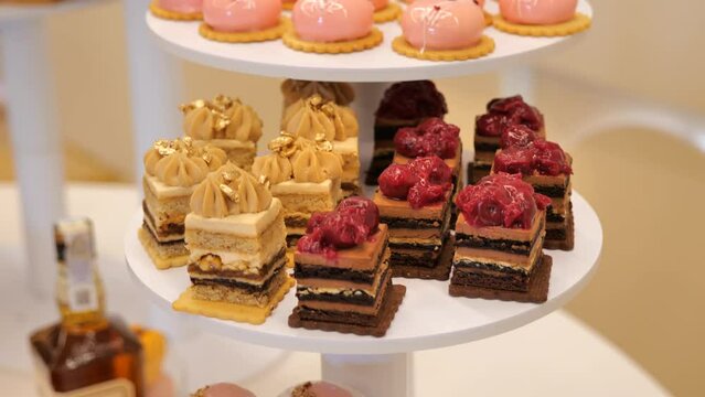 Close up of tray with lot delicious diversity pastry cakes tartlets