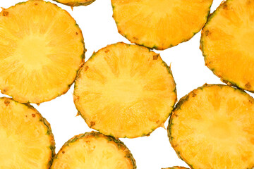 Pineapple juicy yellow slices on a white background.