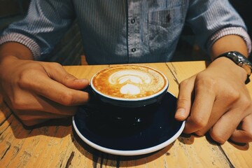person holding a cup of coffee