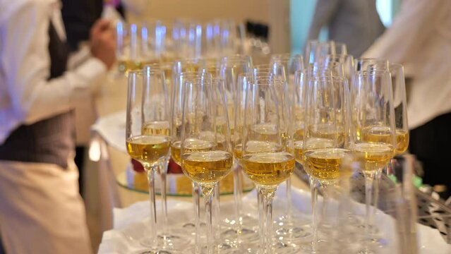 Champagne glasses filled and ready for a celebratory toast