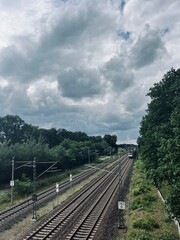 Empty railways in countryside, cloudy sky