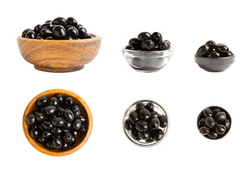 Tasty black olives isolated on white background. Olive and olive tree branches on a white table....