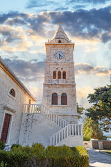 Fototapeta na wymiar St. George's Church made of white limestone in Primosten, Croatia.