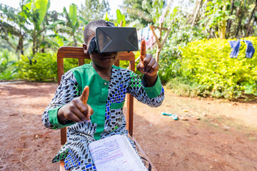 A child uses virtual reality viewers while attending a lesson remotely of school