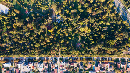 Top down aerial view of  urban grid with park © Nenad