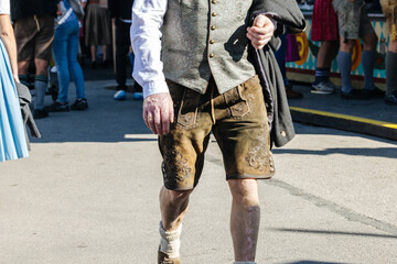 Man wearing the traditional Bavarian Lederhosen at the Oktoberfest in Munich close-up