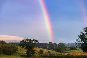 A strong summer rainbow at Irthington, Cumbria, England UK