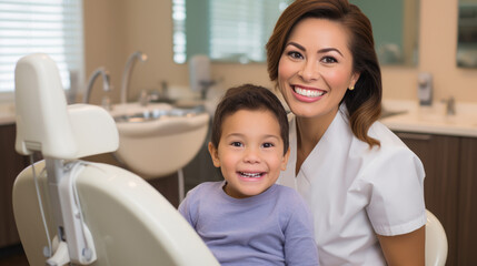 Smiling dentist and a small child at a dental clinic appointment