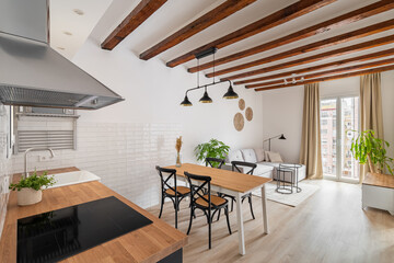 Stylish kitchen and dining area in modern studio apartment