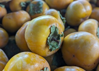 locally grown fresh persimmons on the market