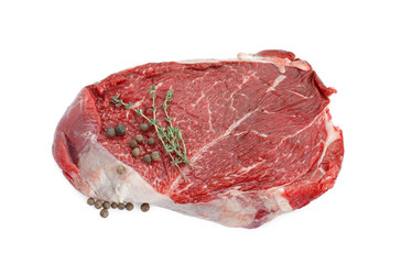 Piece of raw beef meat, peppercorns and thyme isolated on white
