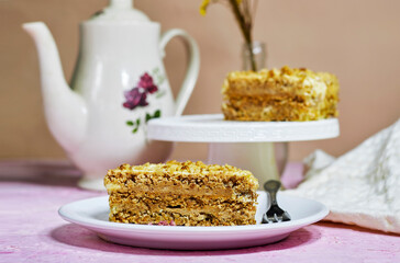 walnut dacquoise cake or Kiev cake with meringue layers and vanilla buttercream with coffee