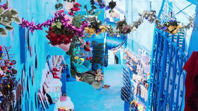 Medina alleys and stairs of Chefchaouen, the famous Blue Pearl of Morocco or Blue City. Chaouen is noted for its buildings in shades of blue, UNESCO heritage. Gimbal Prores cinematic panning - POV