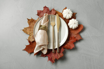 Happy Thanksgiving day. Beautiful table setting and autumn decoration on light grey background,...
