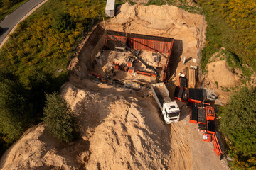 Drone photography of small construction site and workers building a building