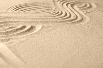 Fototapeta na wymiar Beautiful lines drawn on sand, closeup with space for text. Zen garden