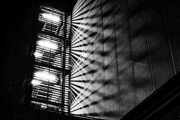 Fire Escape Stair with Light Beam at Night.