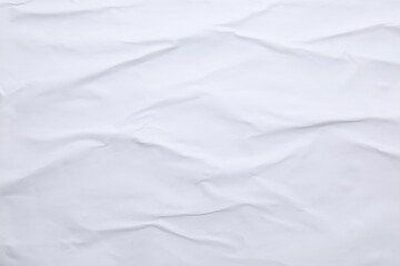 White crumpled sheet of paper as background, top view. Wall poster