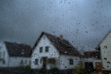 Look out of a window with raindrops on a rainy day