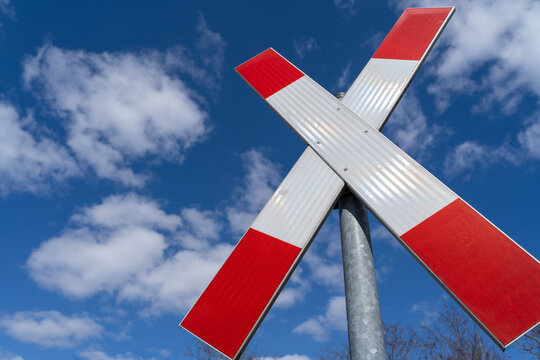 St. Andrew's cross railway sign in the blue sky