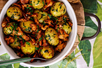 Fried potatoes with chanterelles in a frying pan.top veiw