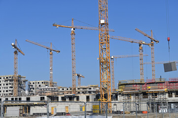 Construction site with cranes machinery and buildings industry