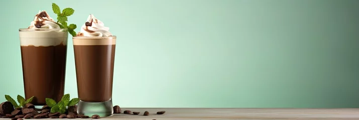 Selbstklebende Fototapeten Peppermint mocha - mint mocha - a classic combination of chocolate, mint and coffee. On a light green background. © Мария Фадеева