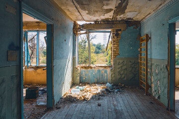 Fototapeta na wymiar View from inside a house destroyed by shelling. War in Ukraine