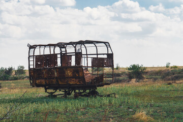 Damaged agricultural equipment destroyed by artillery fire. War in Ukraine