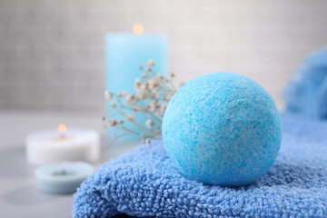 Fototapeta na wymiar Beautiful aromatic bath bomb on towel, closeup. Space for text