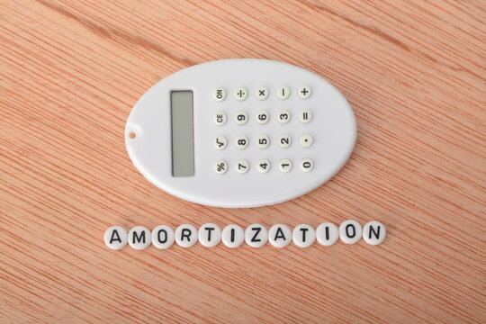 Amortization is a financial term that refers to the process of spreading out the repayment of a loan or the recognition of an expense over time