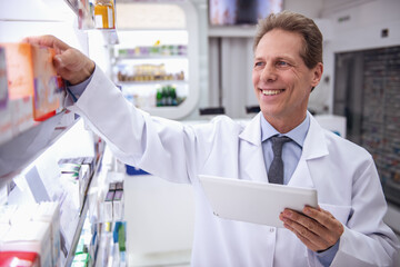 Handsome pharmacist working